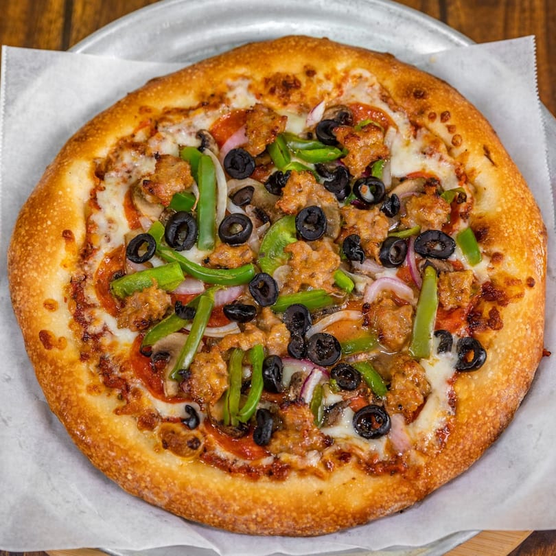 La Pizzeria's pizza with sausage, pepperoni, green peppers, black olives, onions, and mushrooms.